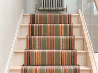 Barbers Flooring | An image showing a red and green Stair Runner