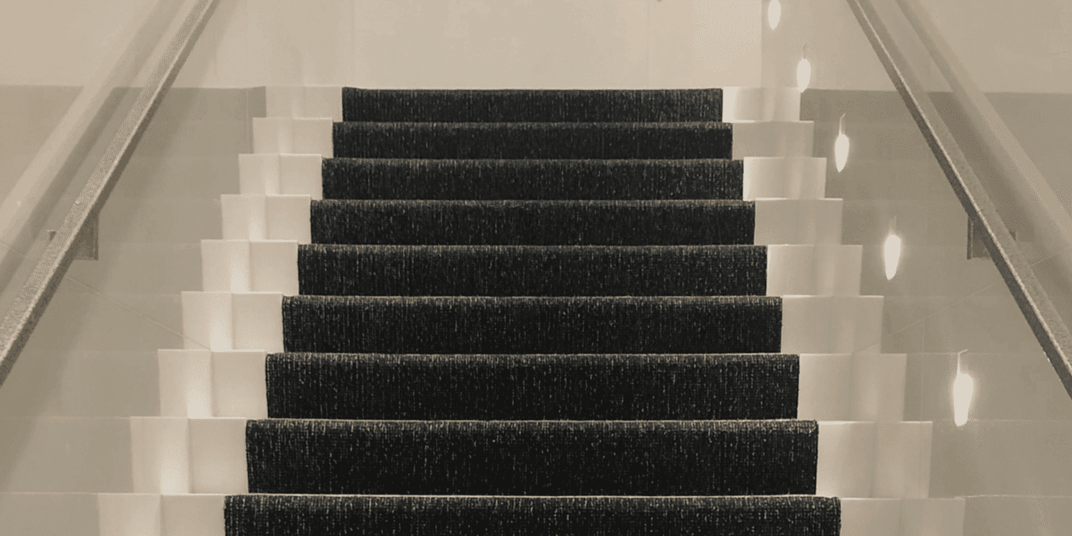 Barbers Flooring | Image displaying a black flatweave stair runner